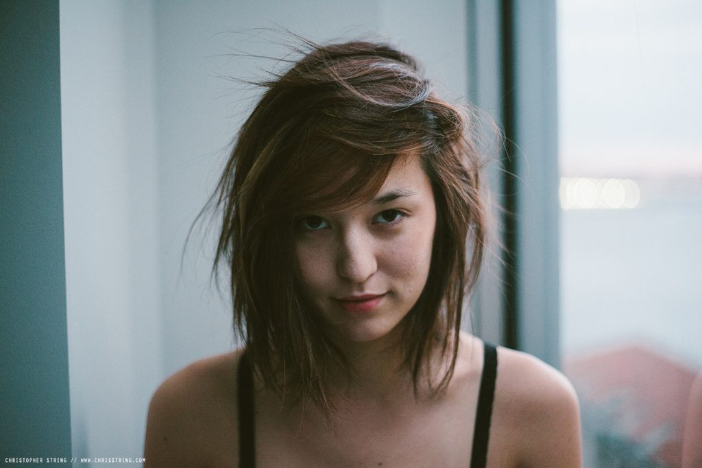 French - Asian Woman looks into the Camera