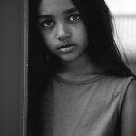Young girl with dark hair in portrait session by Christopher String